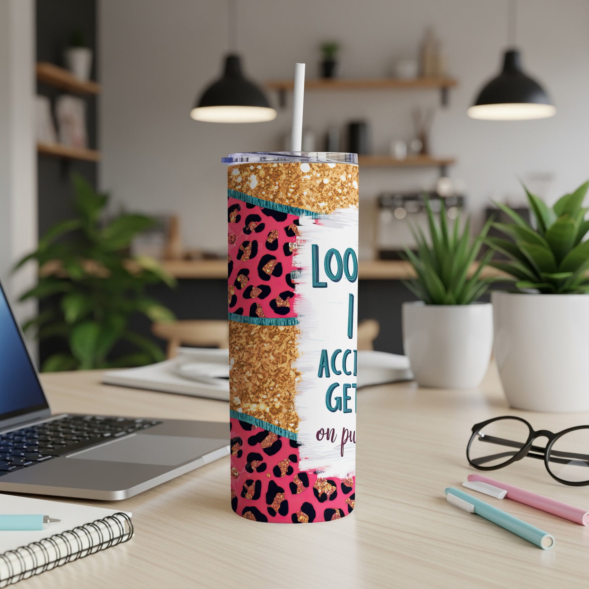 Pink leopard print tumbler with gold glitter accents and text.
