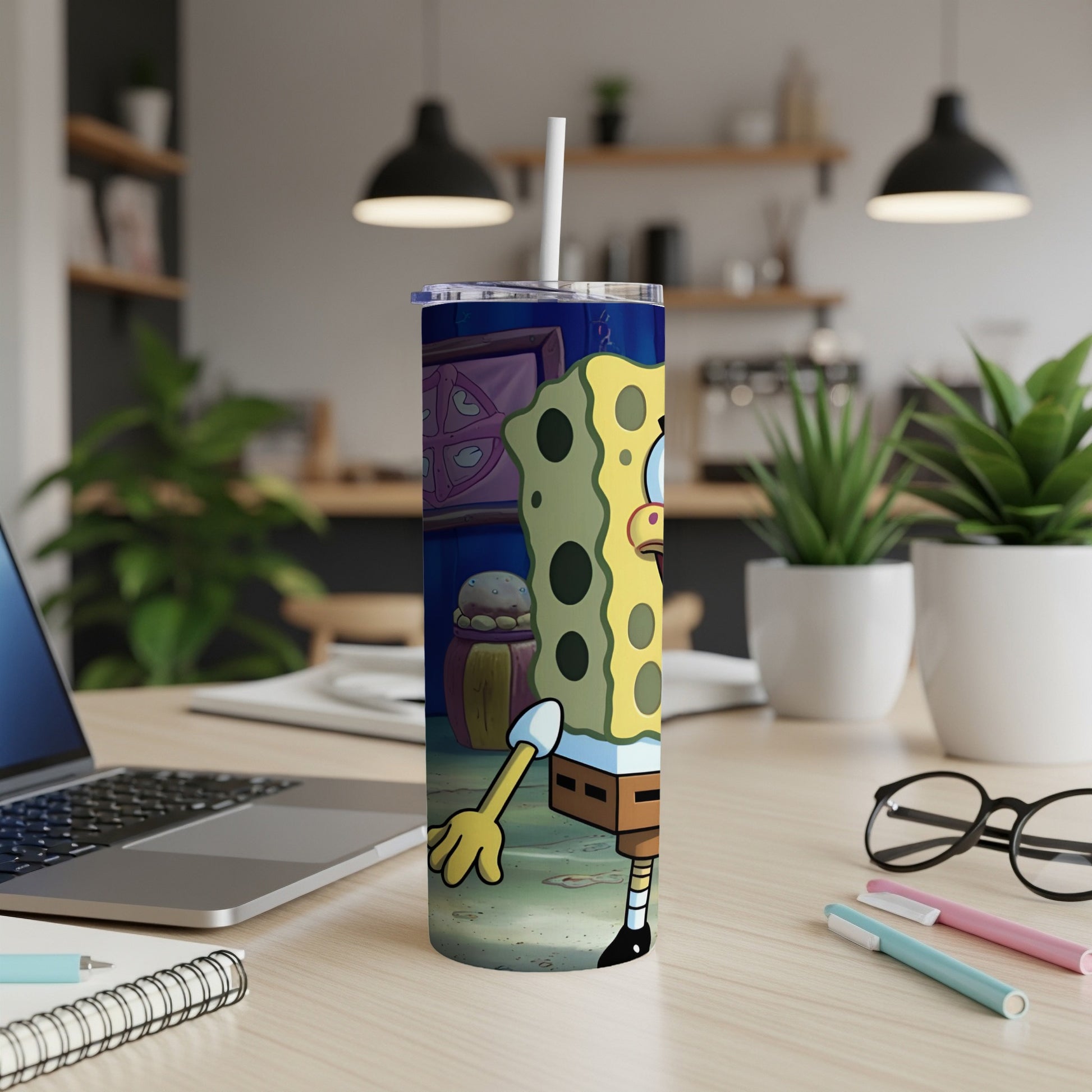 SpongeBob SquarePants character illustration on a white skinny tumbler with a straw.