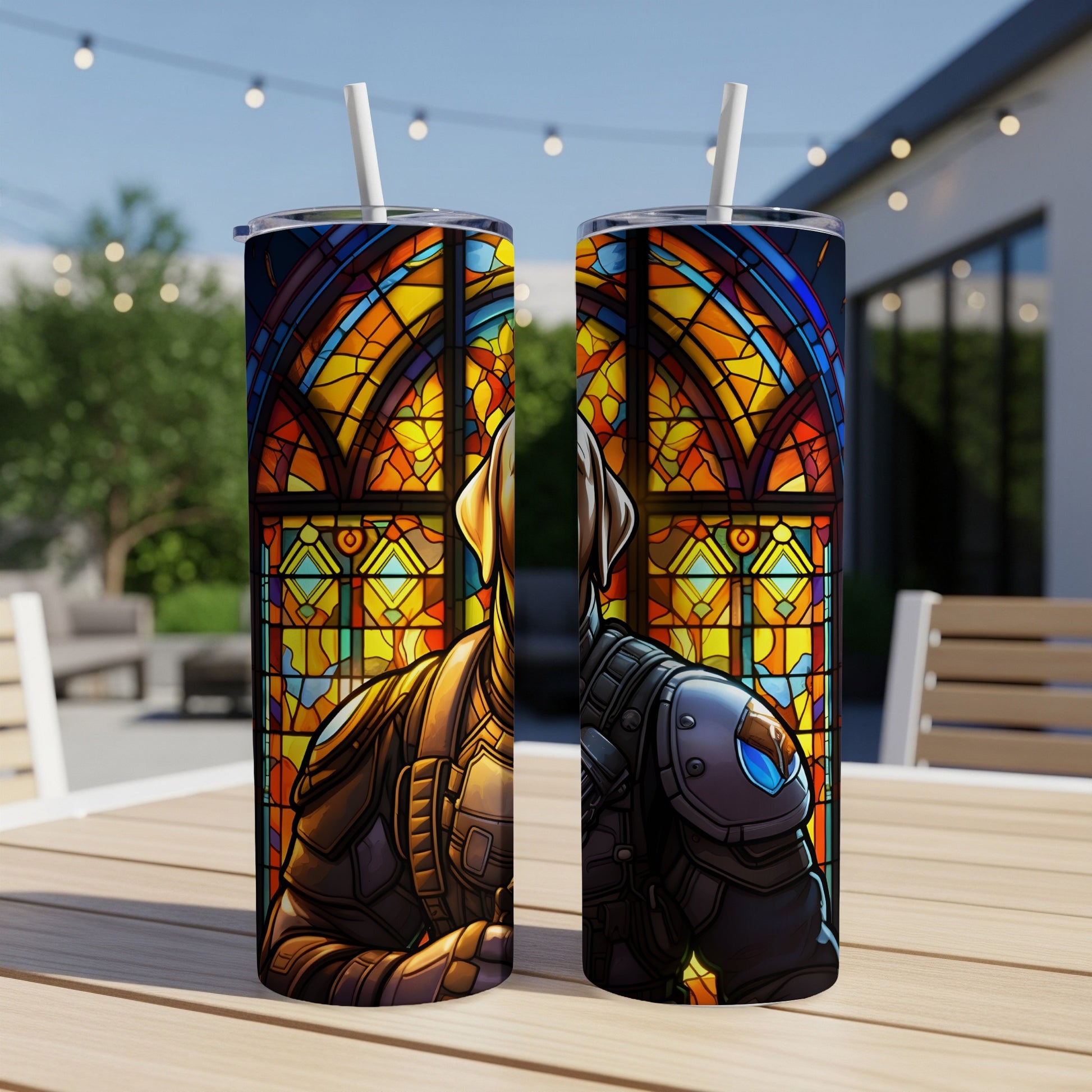 Two tumblers with stained glass design of a dog in armor on an outdoor table.
