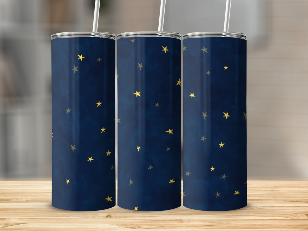 Three tumblers with a dark blue, starry night pattern and white straws.