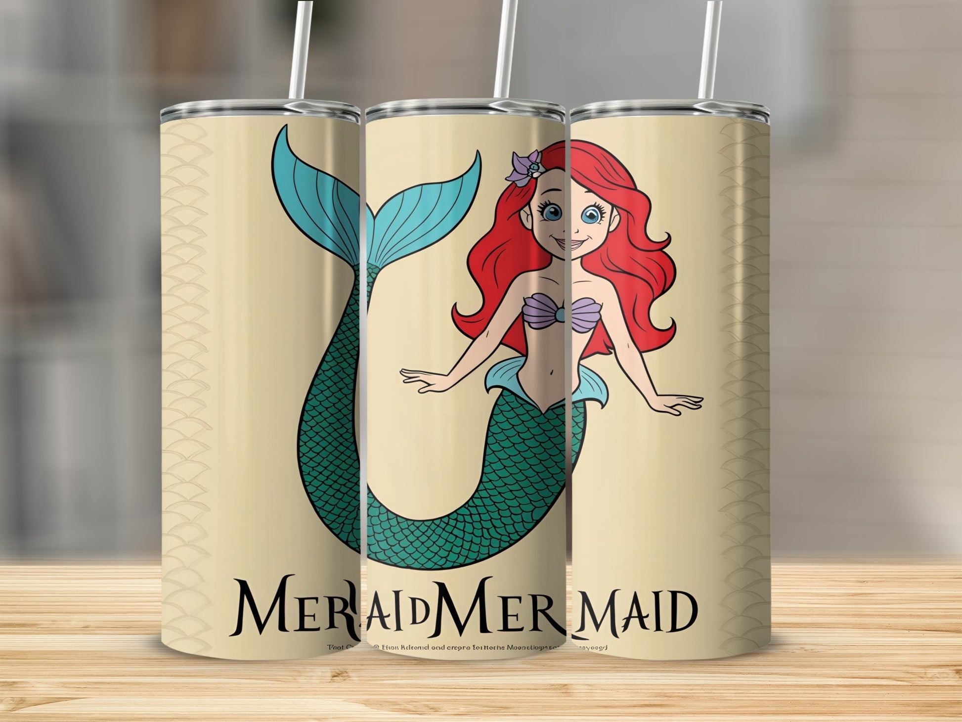 Three tumblers featuring a cartoon mermaid with red hair and a green tail.