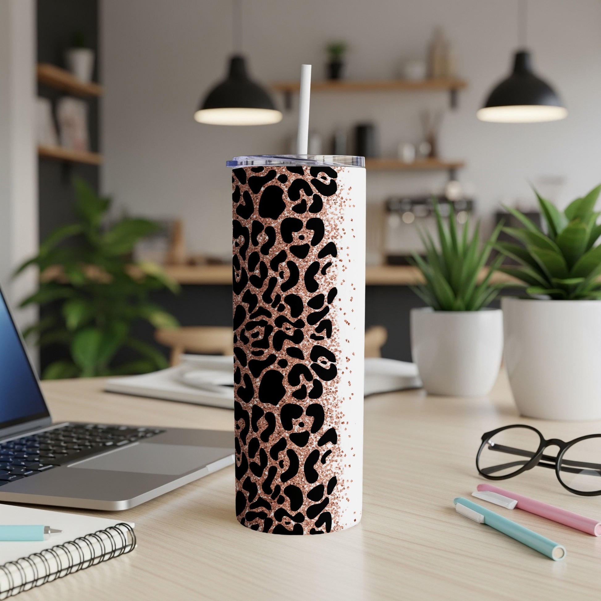 White tumbler with rose gold leopard print and glitter accents.