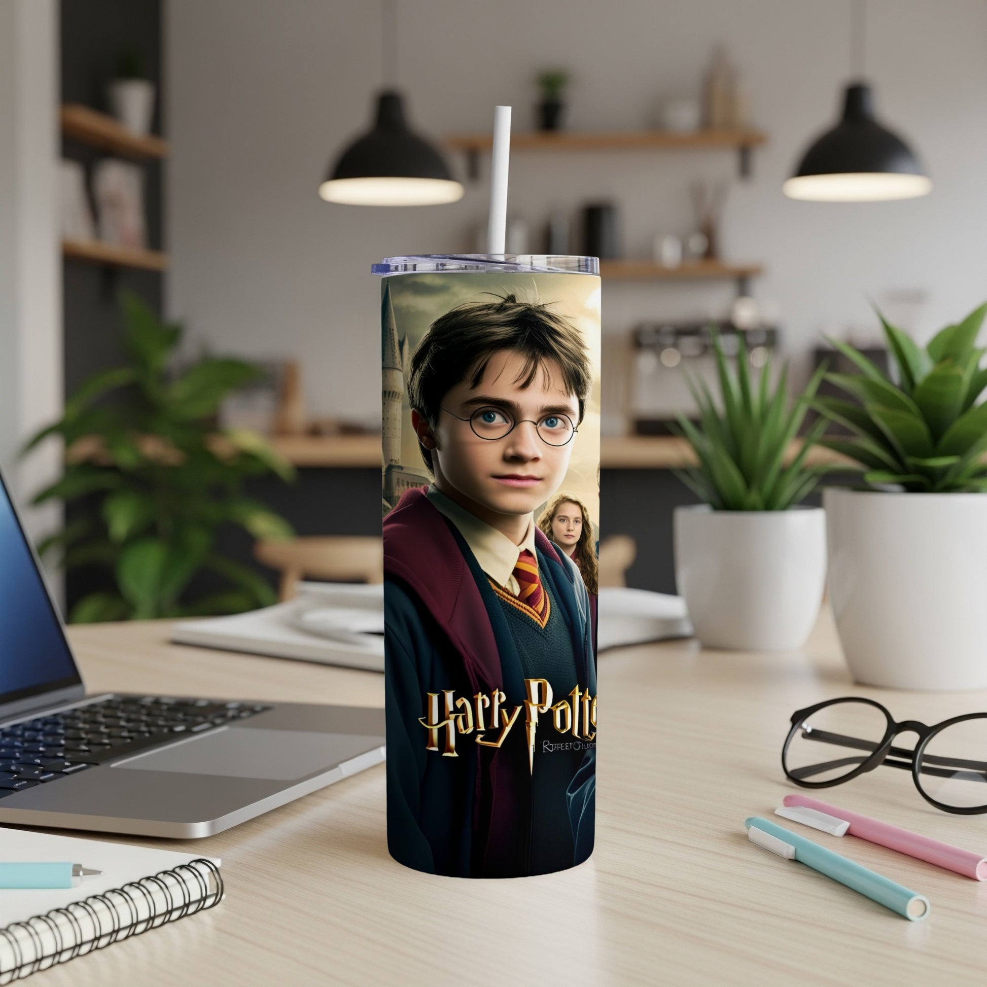 Harry Potter and the Sorcerer's Stone tumbler with straw on desk.