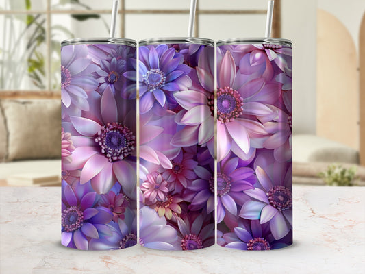 Three tumblers with vibrant purple floral designs displayed on a marbled surface.