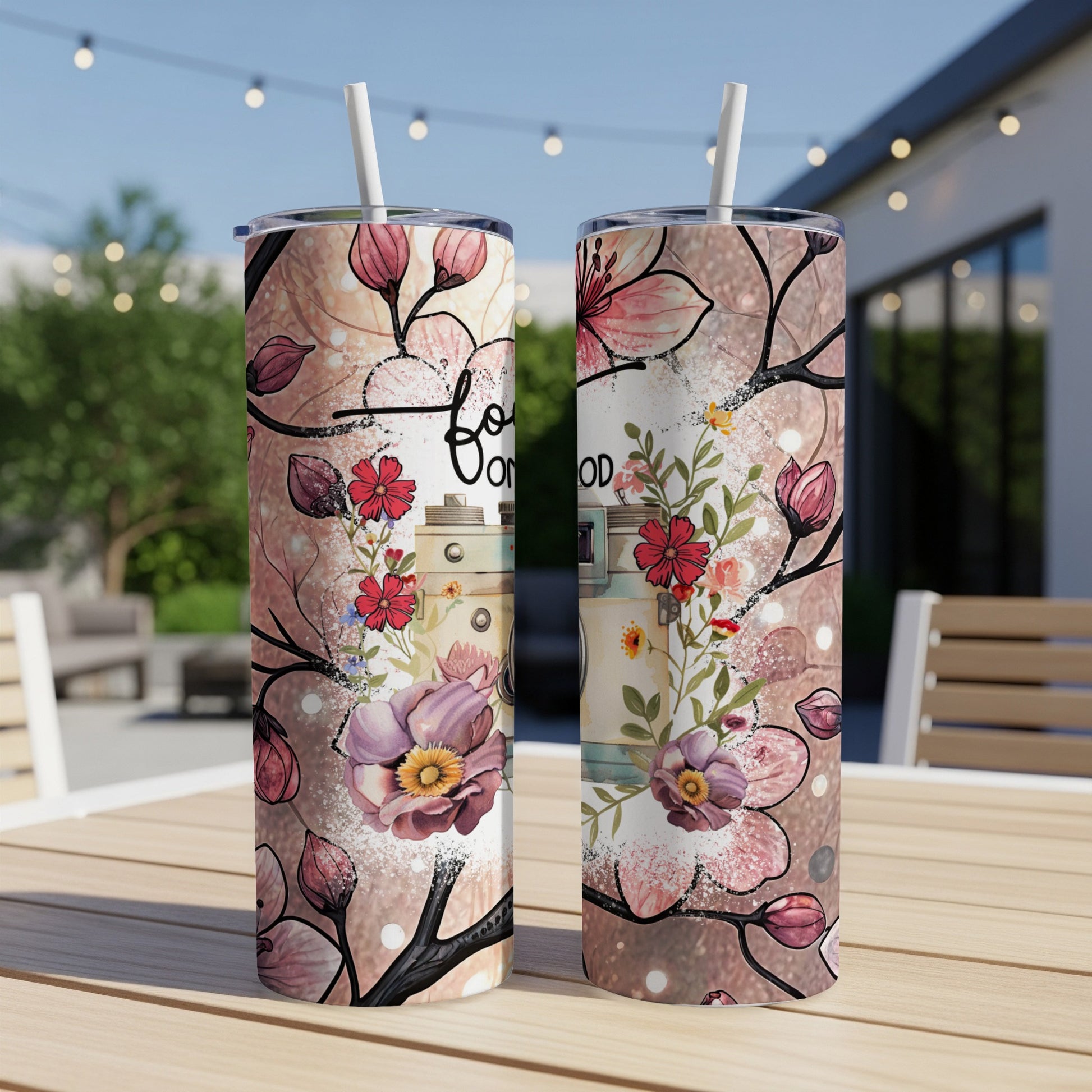 Floral design with text "Good Vibes" on two skinny tumblers.