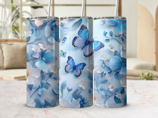 Three tumblers featuring blue butterflies and delicate white flowers.