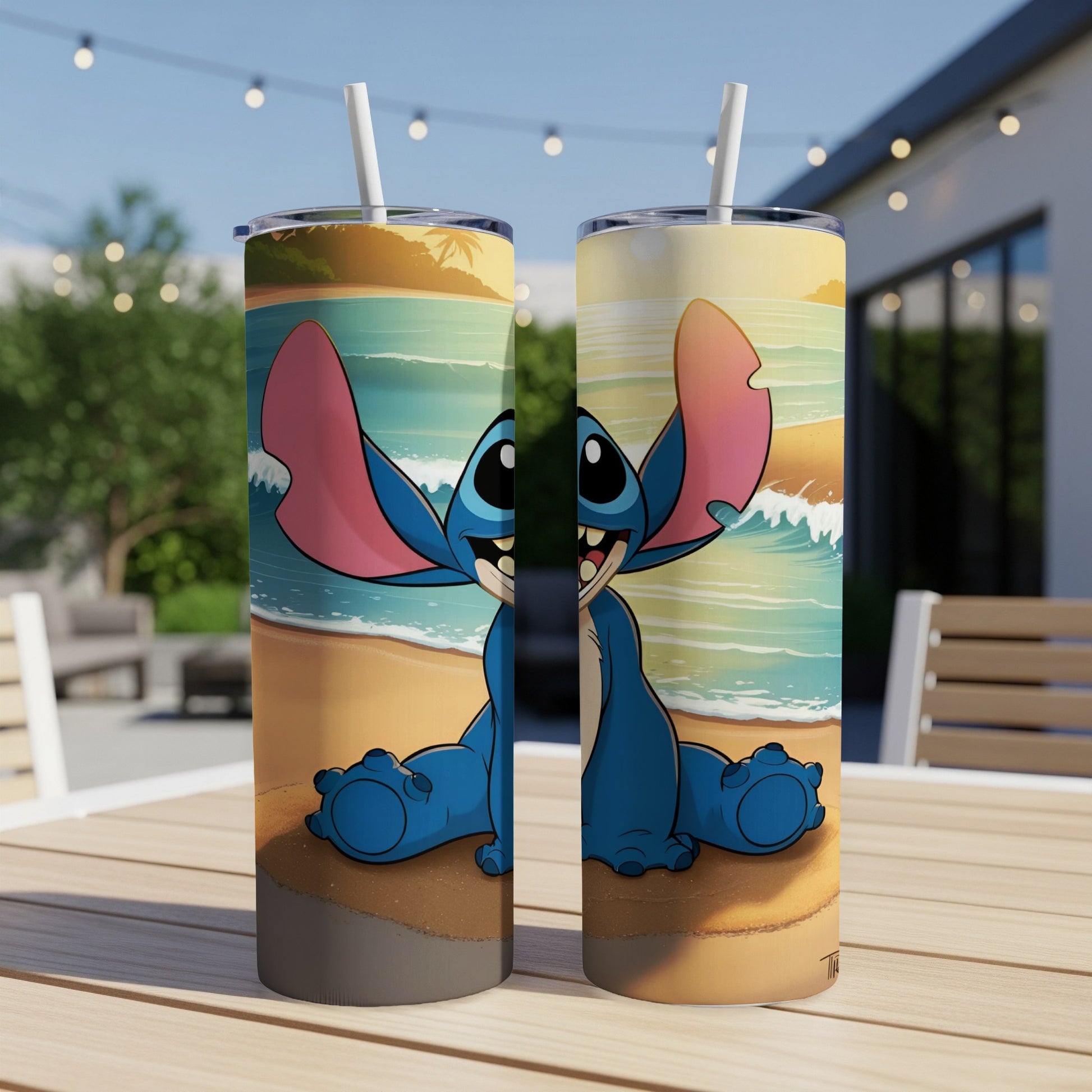 Two Stitch tumblers on a table with a beach scene background.
