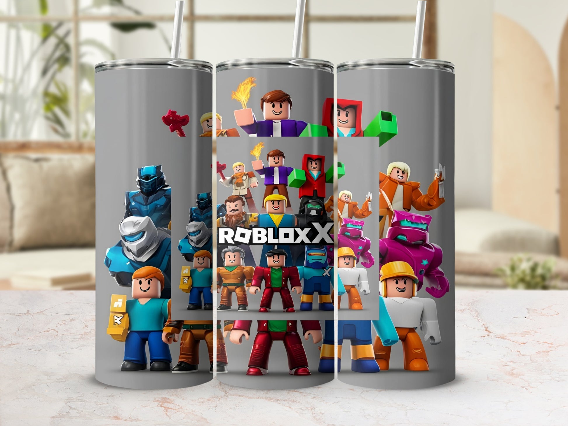 Roblox characters and logo on a stainless steel tumbler with straw.