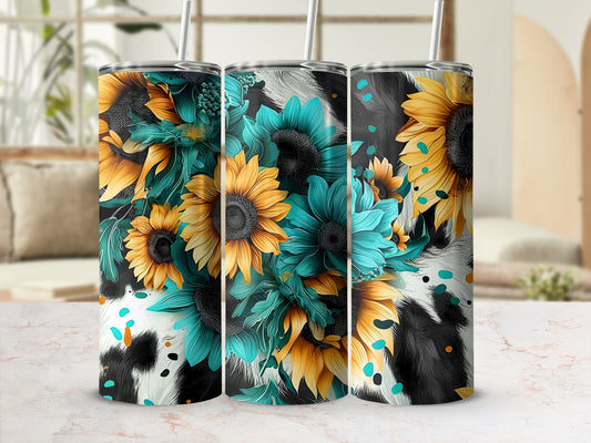 Three tumblers with sunflowers and turquoise flowers on a cow print background.