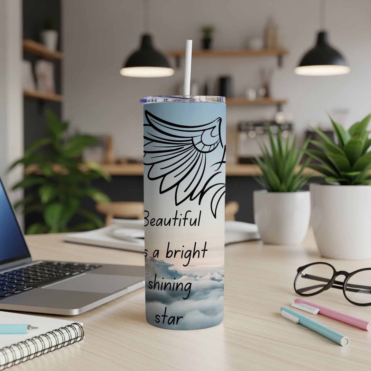 Tumbler with angel wings and text "Beautiful as a bright shining star".