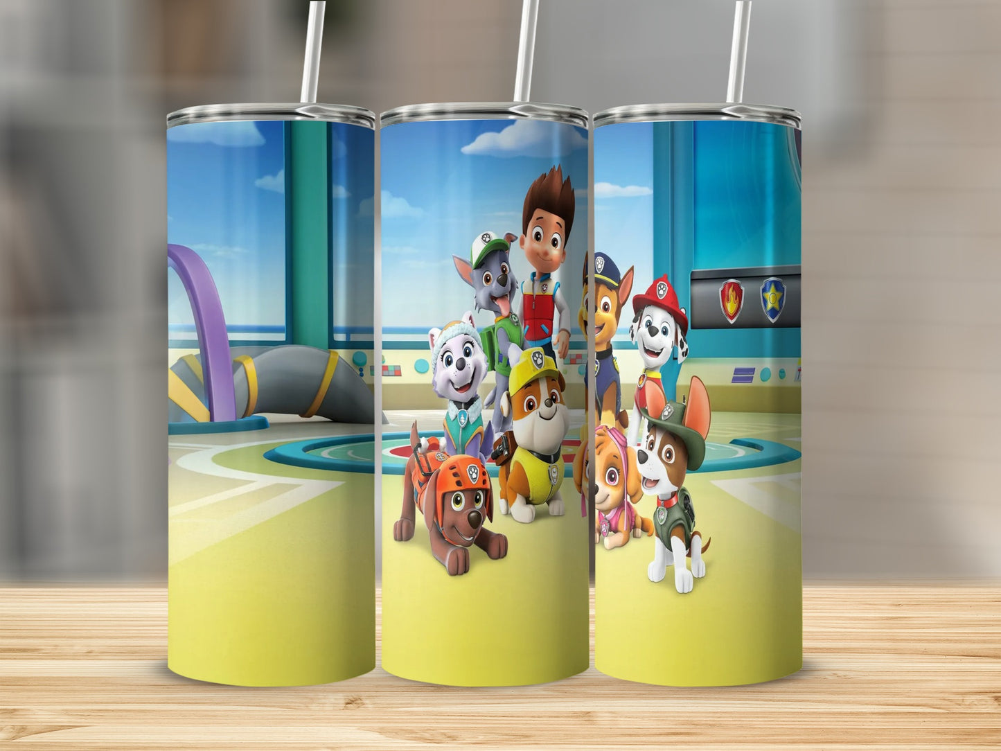 Paw Patrol characters on a yellow tumbler with a straw.