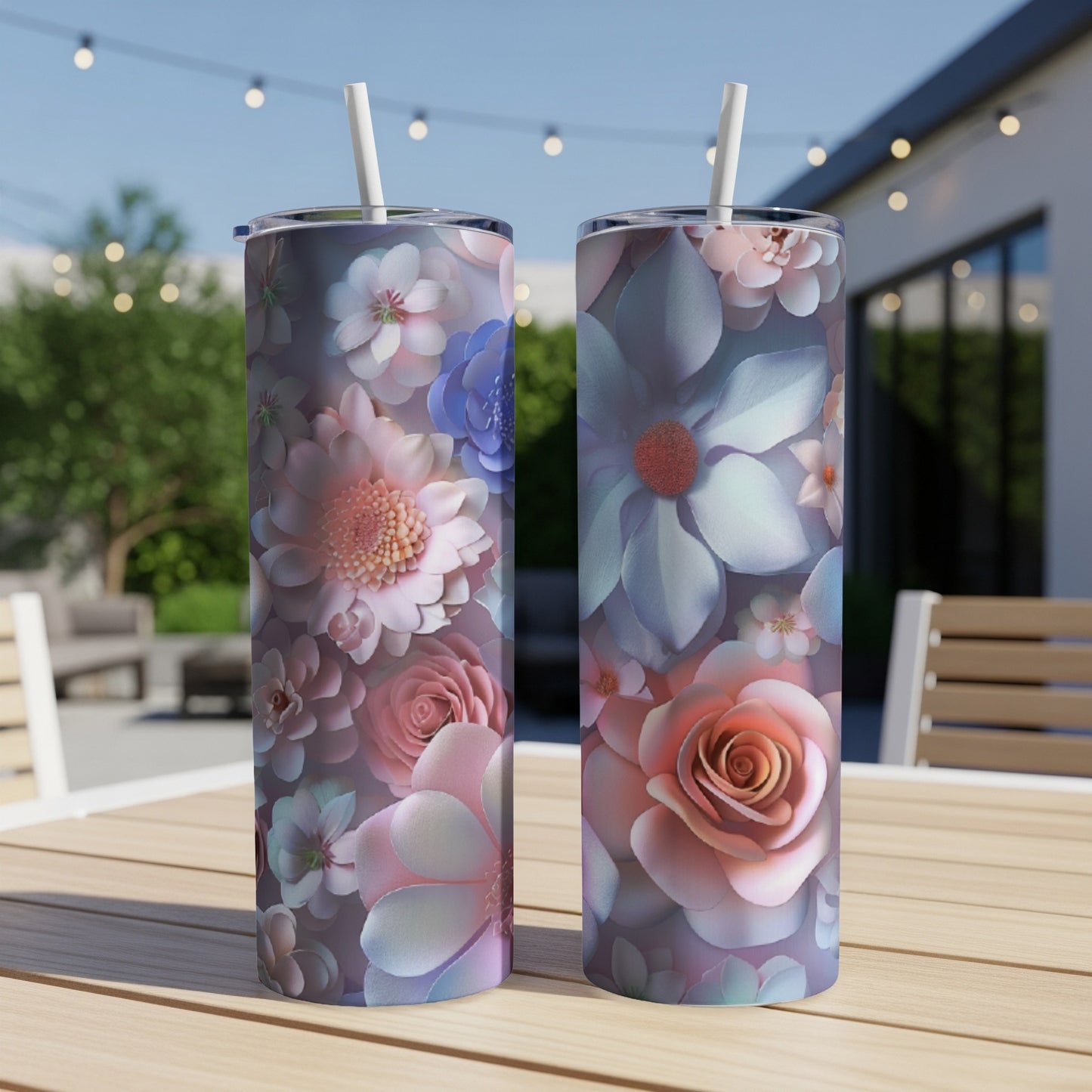 Two tall tumblers with a floral pattern of pink, purple, and blue flowers.