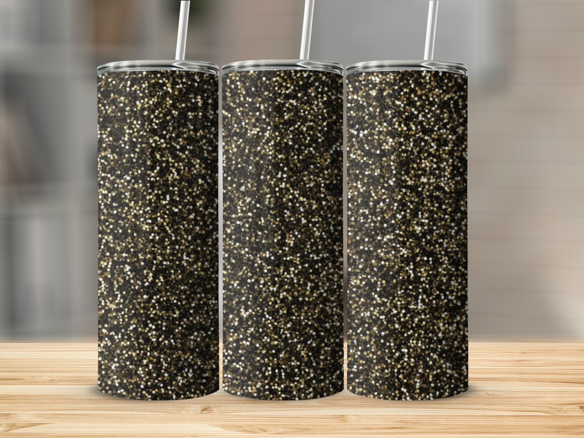 Three tall tumblers with a gold and black glitter design.