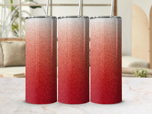 Three glitter tumblers with ombre red to white gradient and straws.