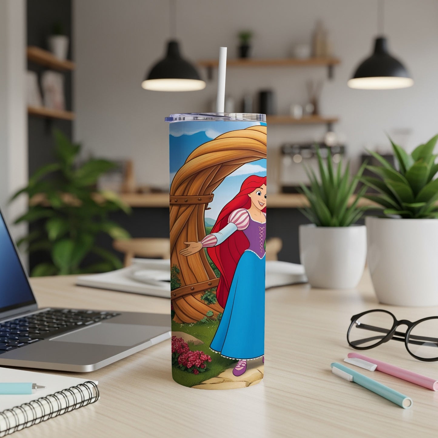 Ariel from The Little Mermaid on a blue tumbler with a straw.