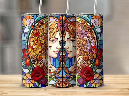 Stained glass design of two women's faces surrounded by flowers and roses.
