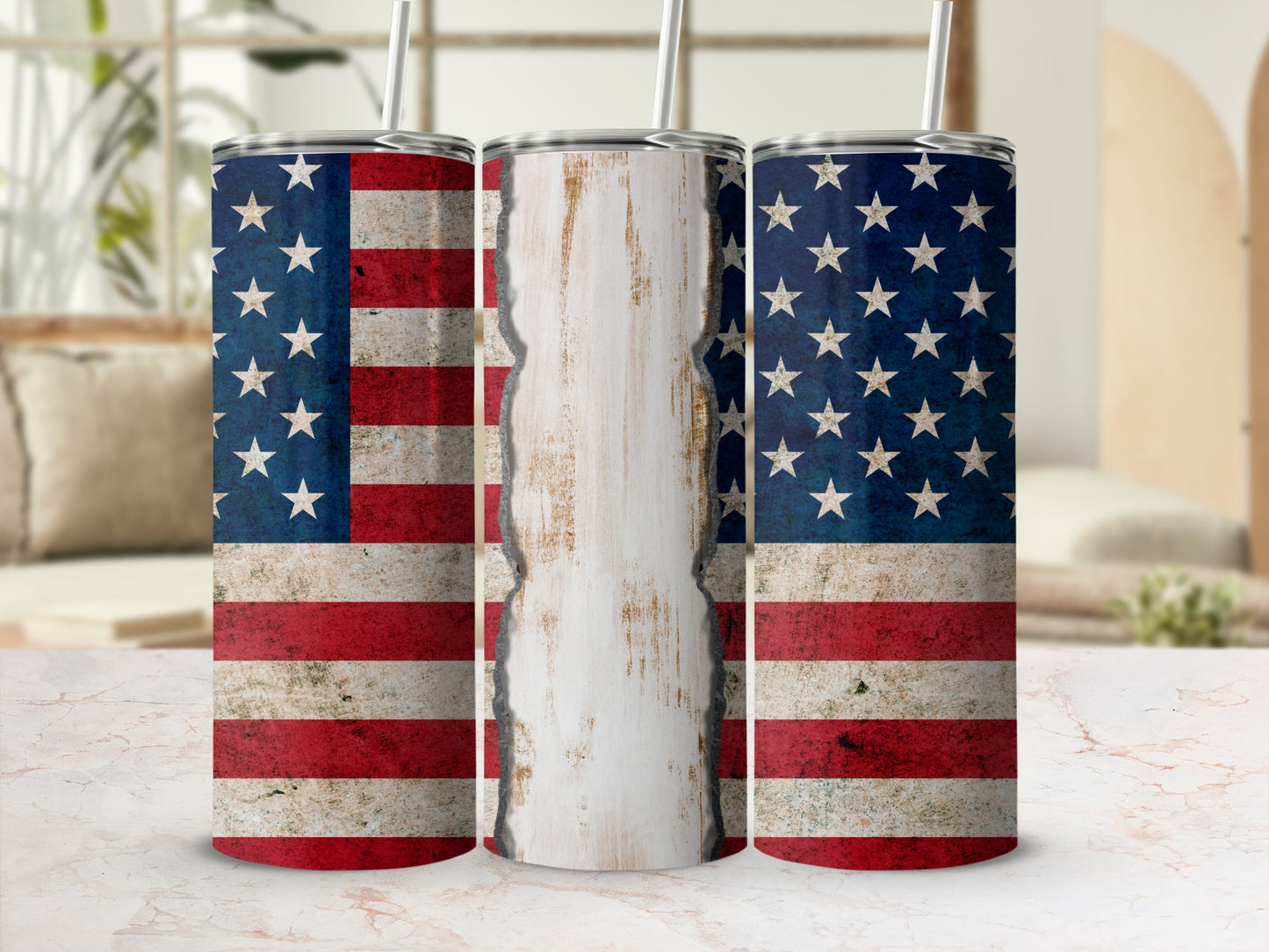 Three tumblers decorated with distressed American flags, one central with distressed white wood.