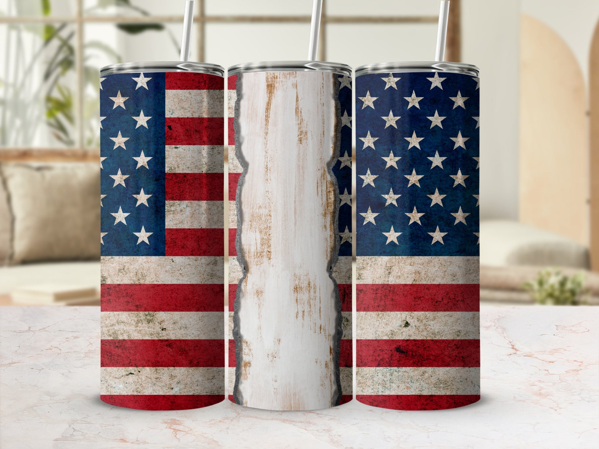 Three tumblers decorated with distressed American flags, one central with distressed white wood.