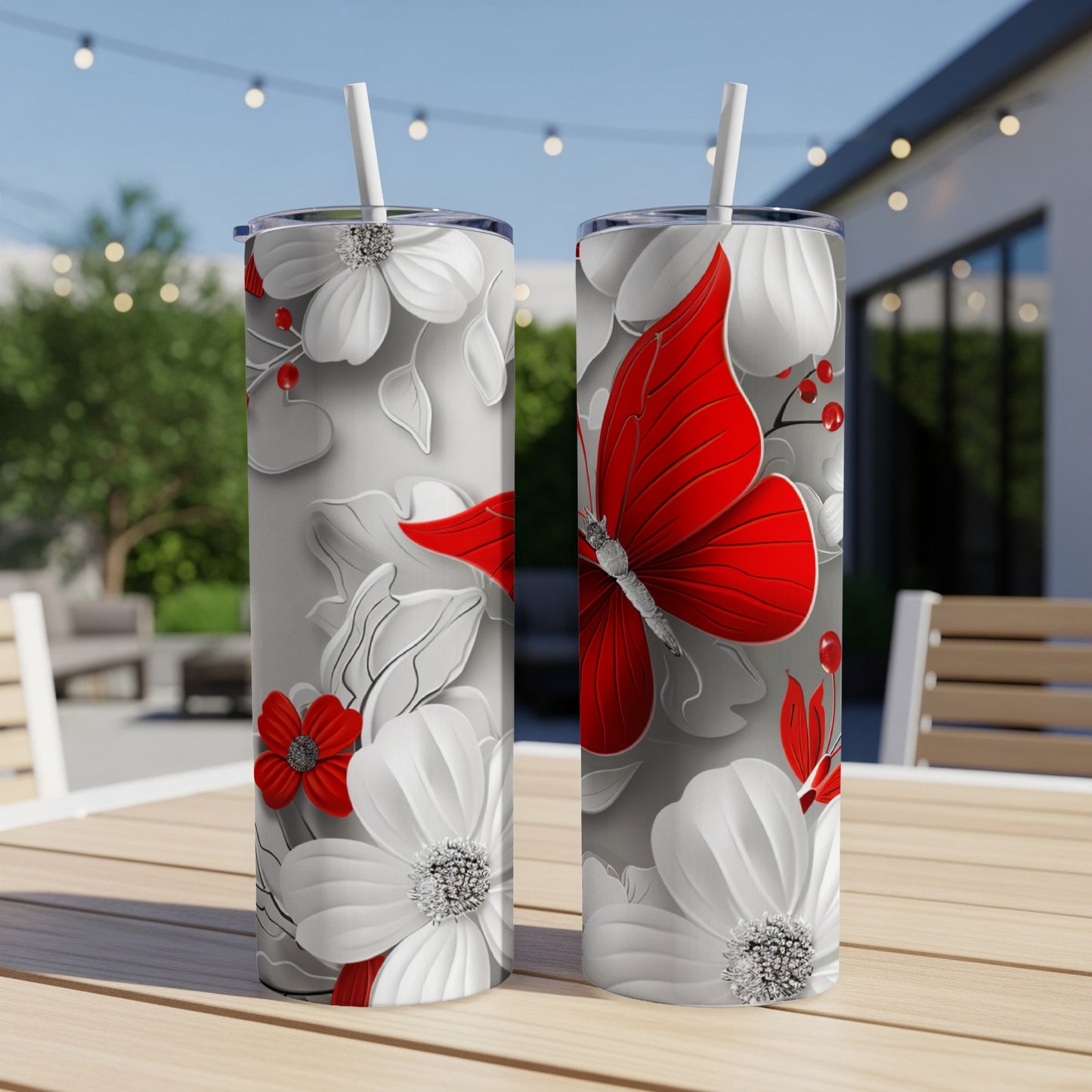 Two tumblers with a red butterfly and white floral design.
