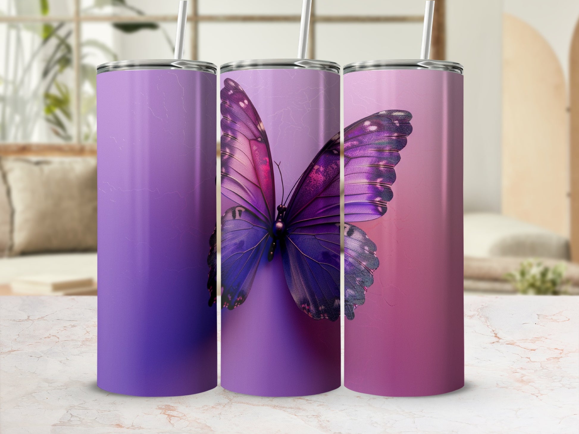 Three purple ombre tumblers featuring a vibrant butterfly design.