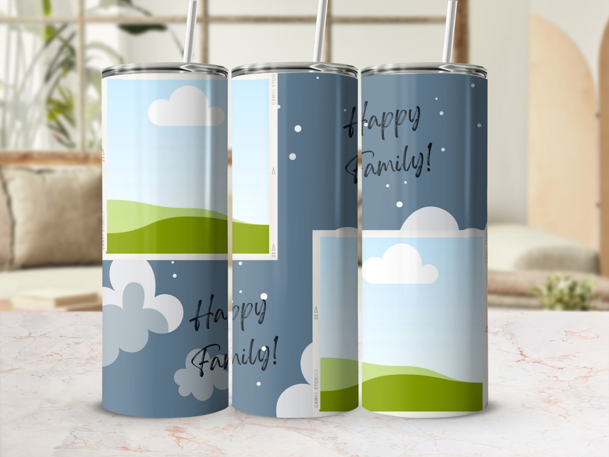 Three tumblers with a "Happy Family!" design and a sky and rolling hills graphic.
