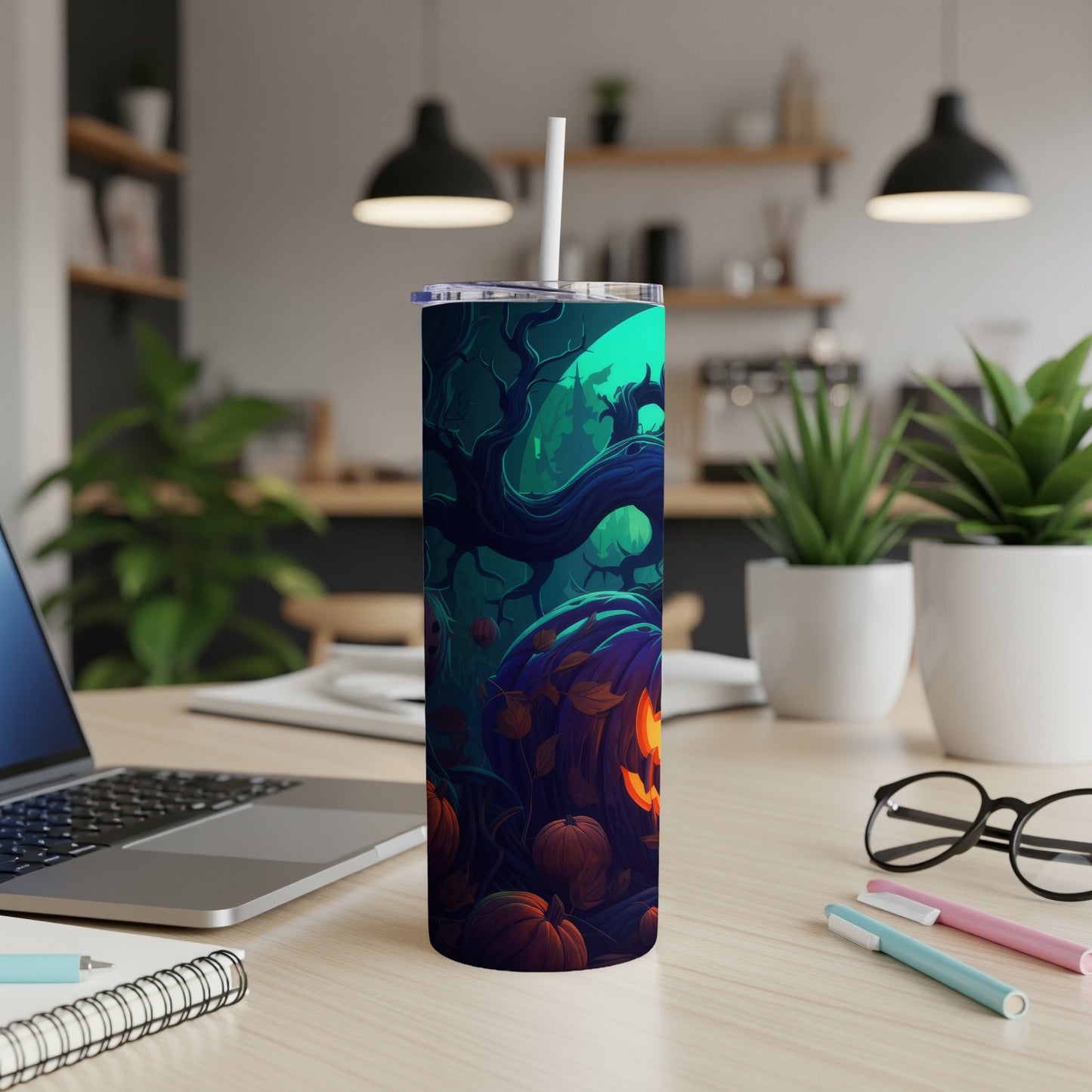 Tumbler with a Halloween forest scene featuring pumpkins and trees.