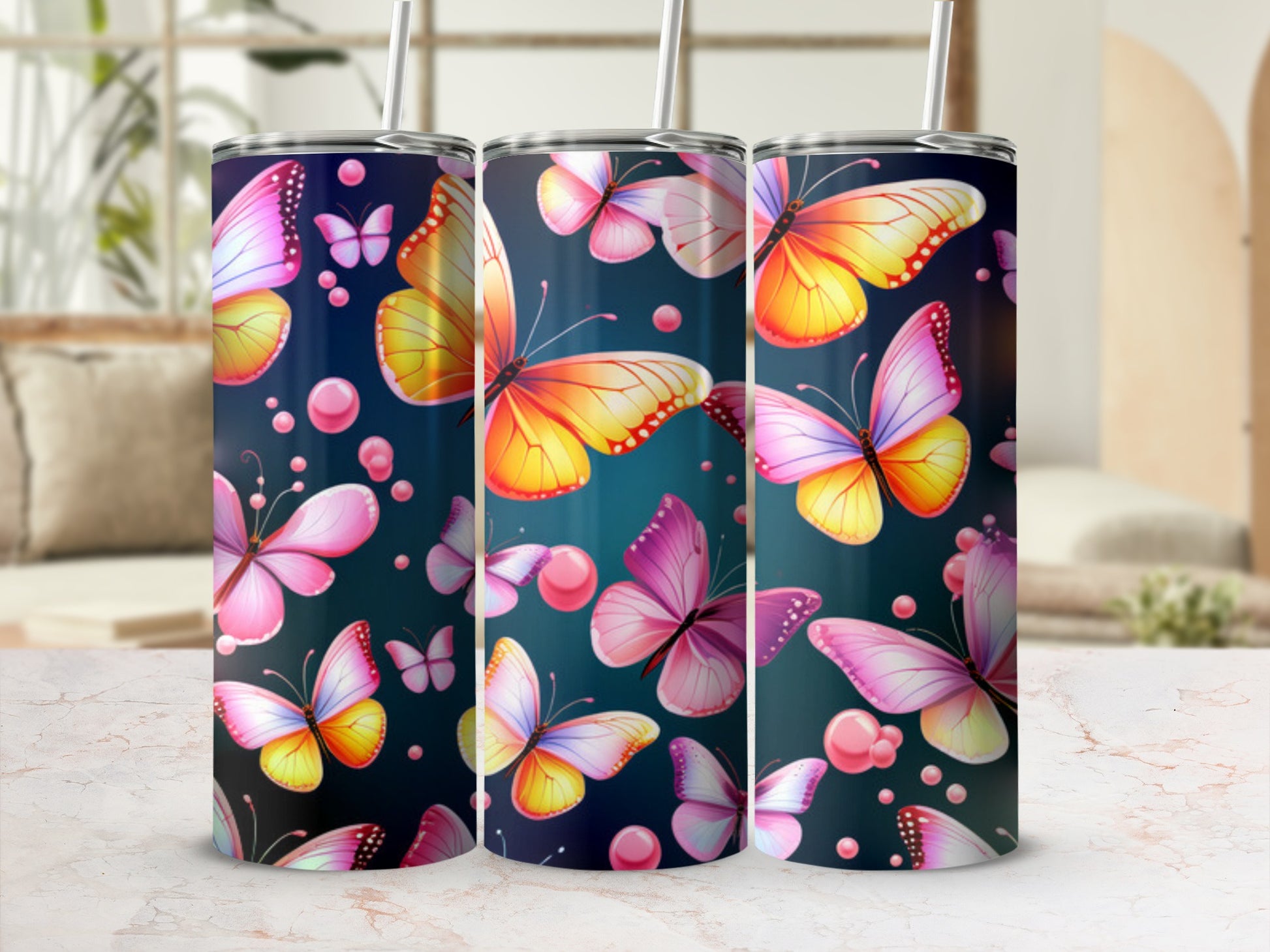 Three tumblers adorned with colorful butterflies on a dark background.