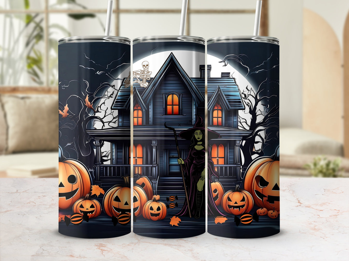 Halloween tumbler with witch, pumpkins, and haunted house design.