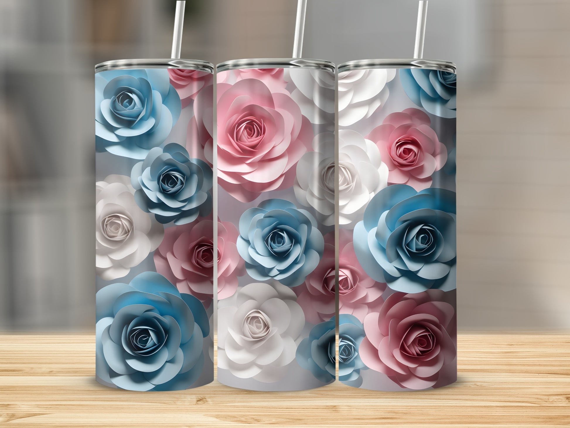Three tumblers with a pattern of pink, blue, and white paper flowers.