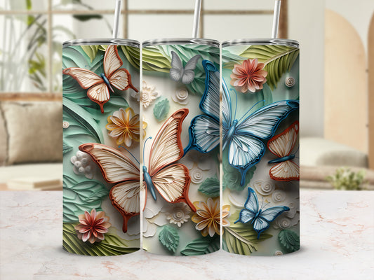 Three tall tumblers with butterfly and floral designs, suitable for sublimation.