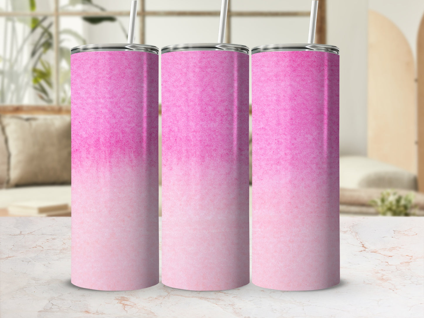Three pink ombre gradient stainless steel tumblers with straws.