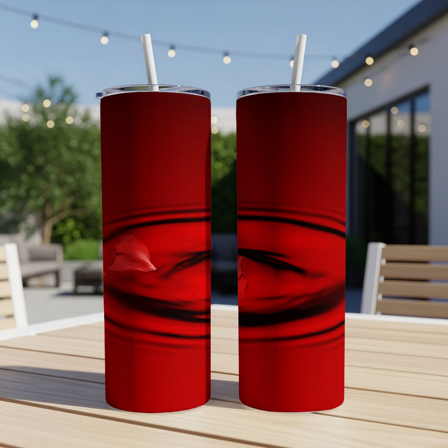 Two tall red tumblers with abstract black and red ripple design.