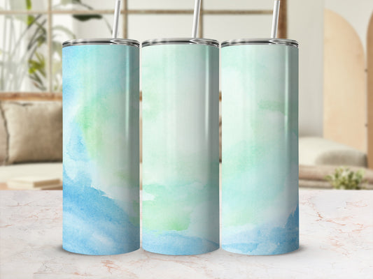 Three tumblers with watercolor blue and green abstract designs.