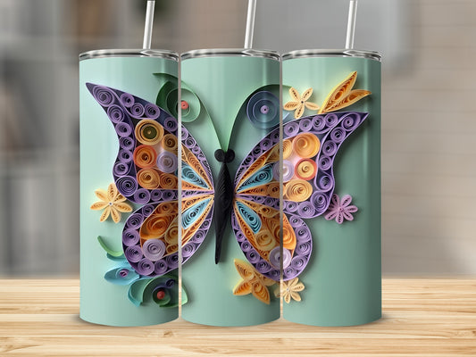 Light blue tumbler with purple, orange, and yellow quilled paper butterfly design.