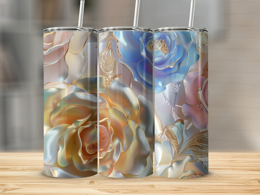 Three tumblers with iridescent rose designs and straws on a wooden surface.