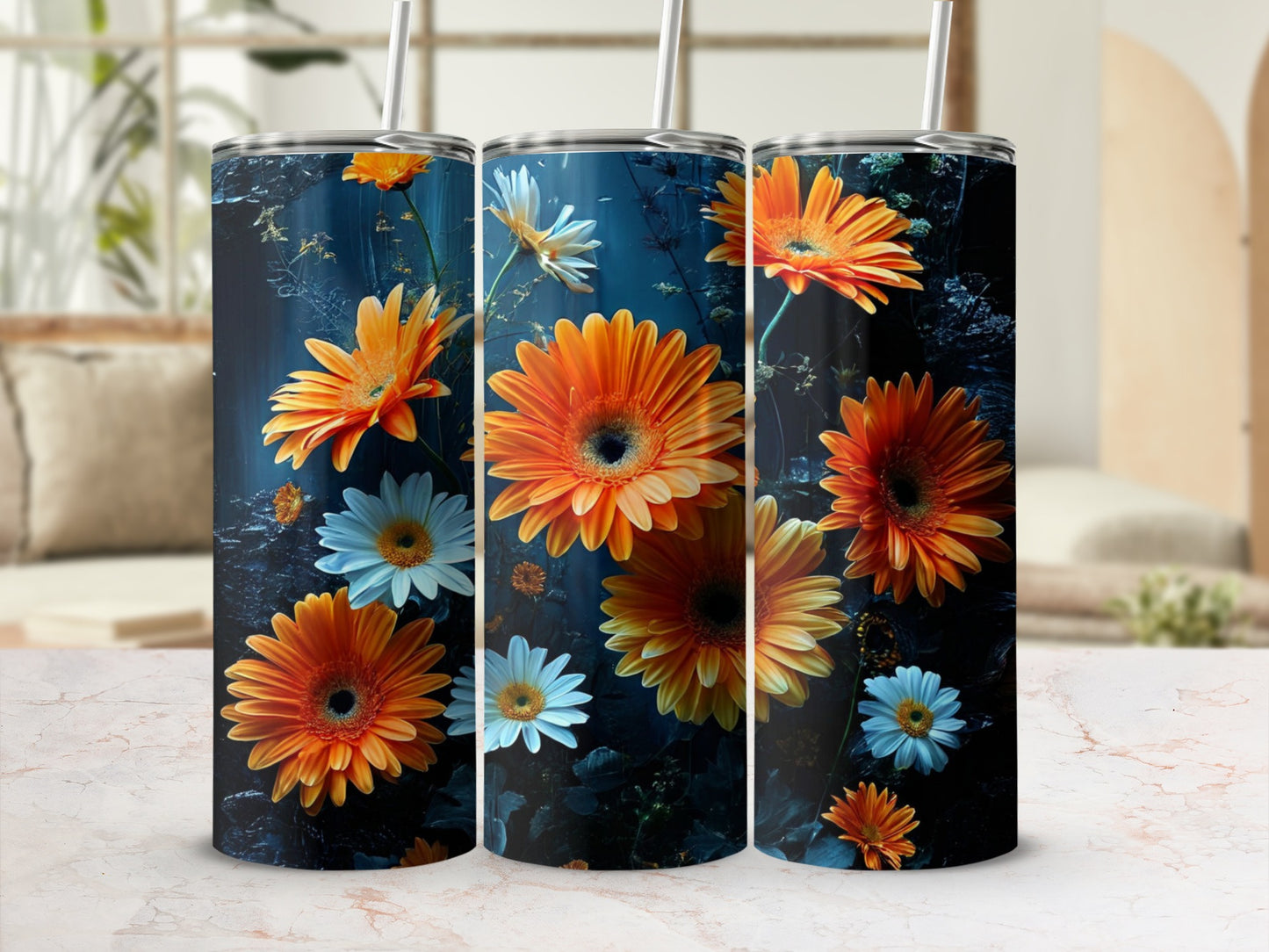 Three tumblers featuring orange and white daisies against a dark floral background.