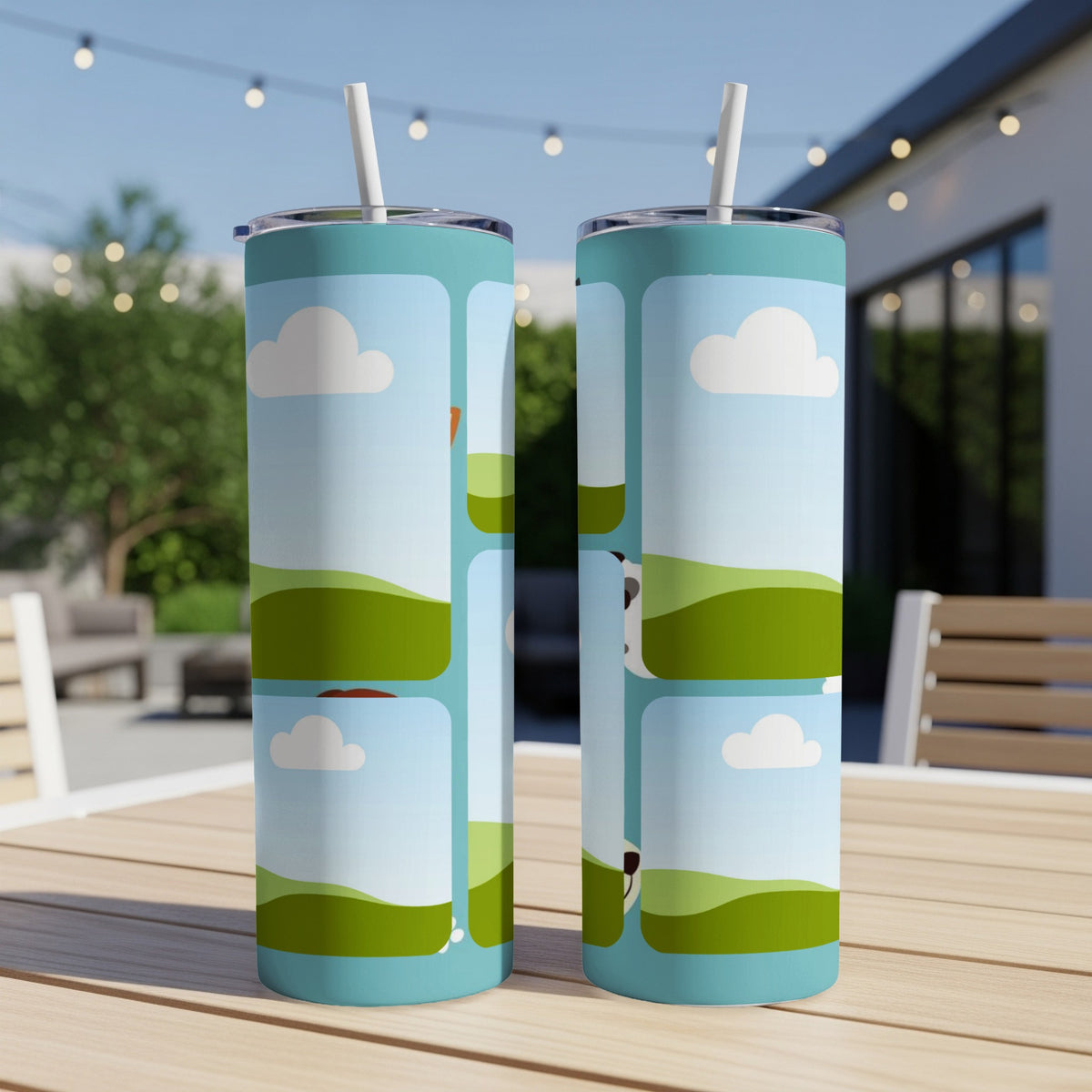 Two tumblers with cartoon farm animals and clouds on a table.