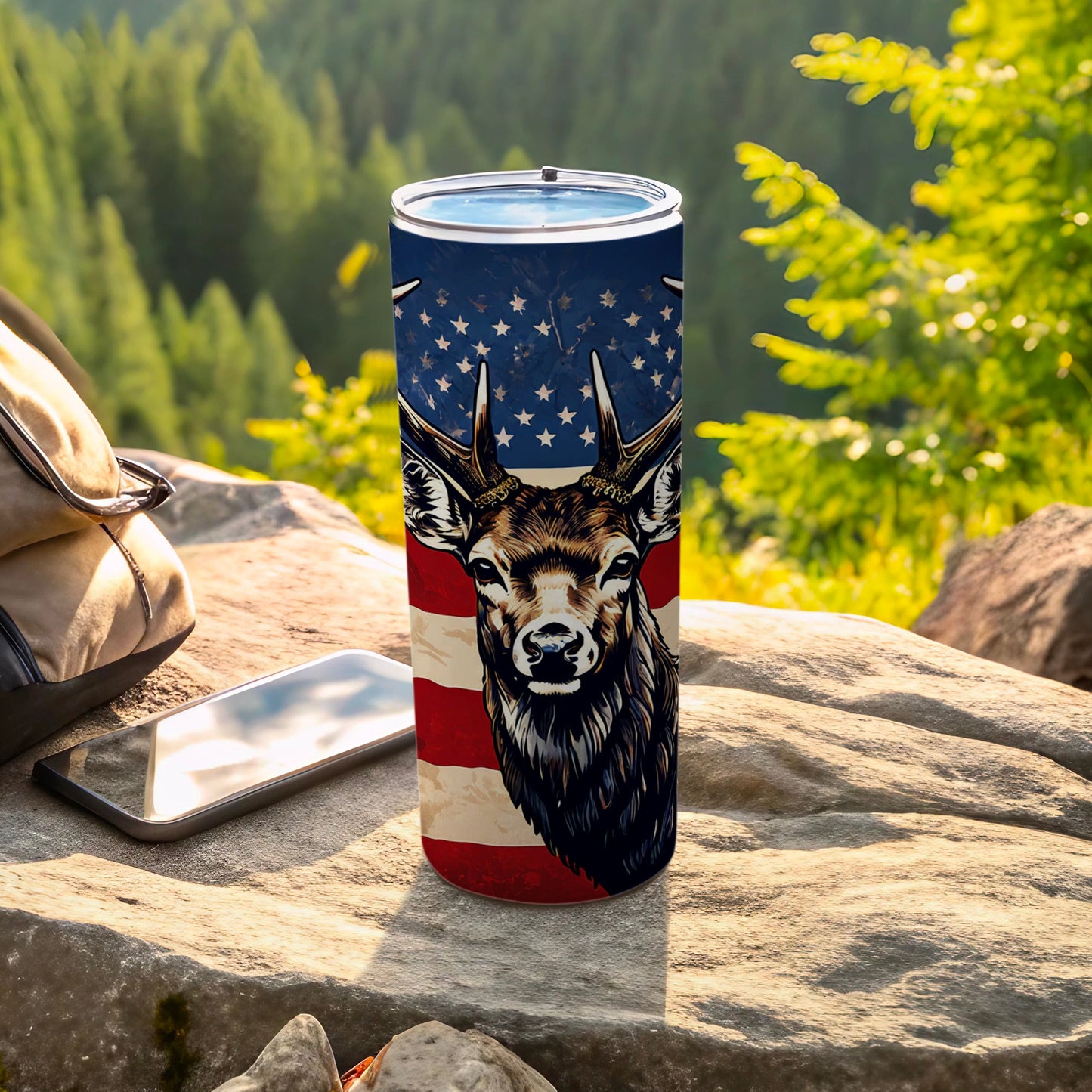 Deer head with American flag pattern on a tumbler, outdoors.