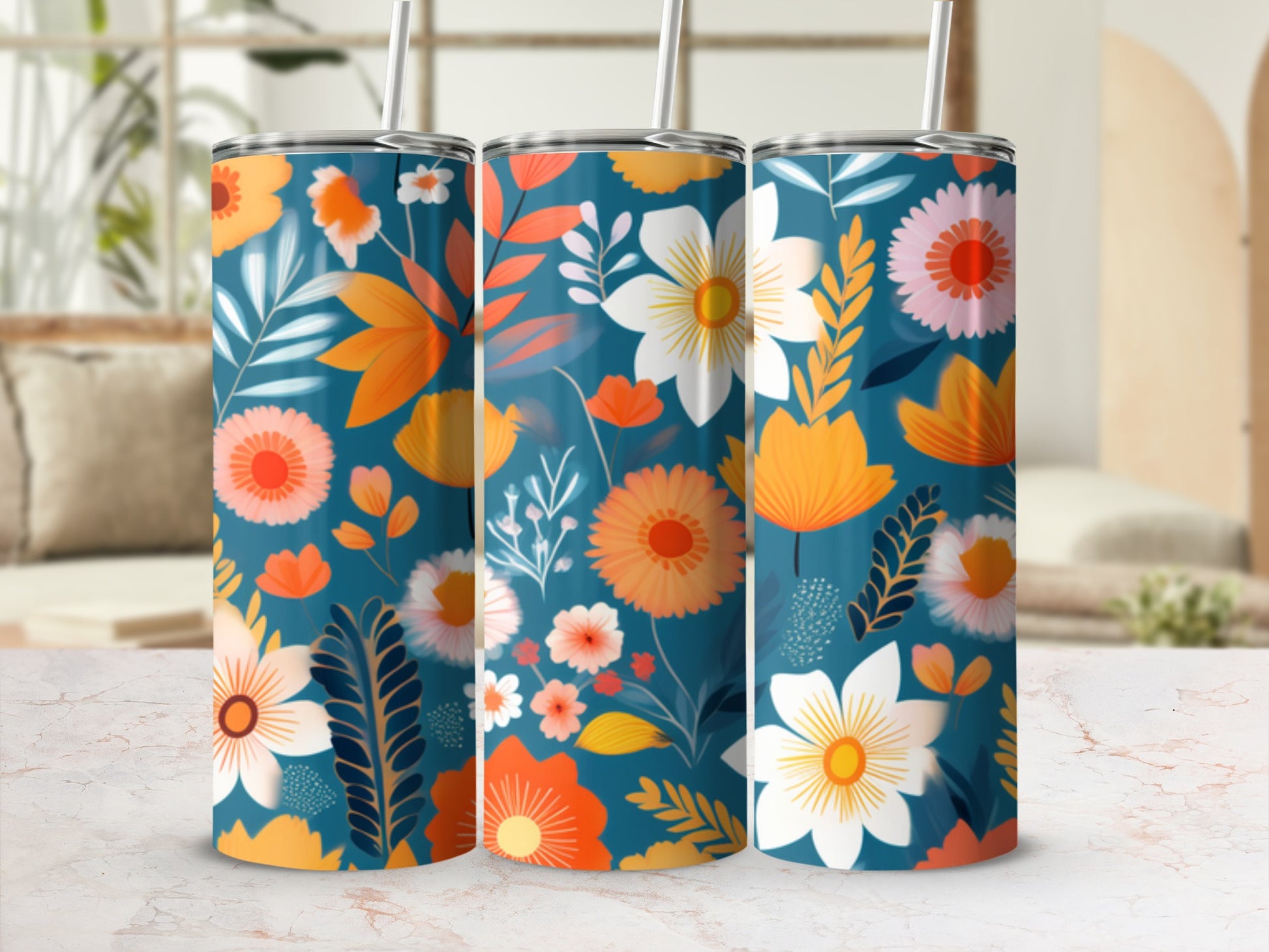 Three tumblers with a vibrant floral pattern in teal, orange, and pink.