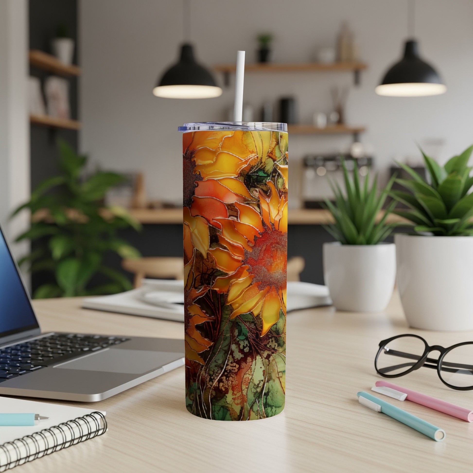 Tumbler with a vibrant sunflower and leaf pattern.