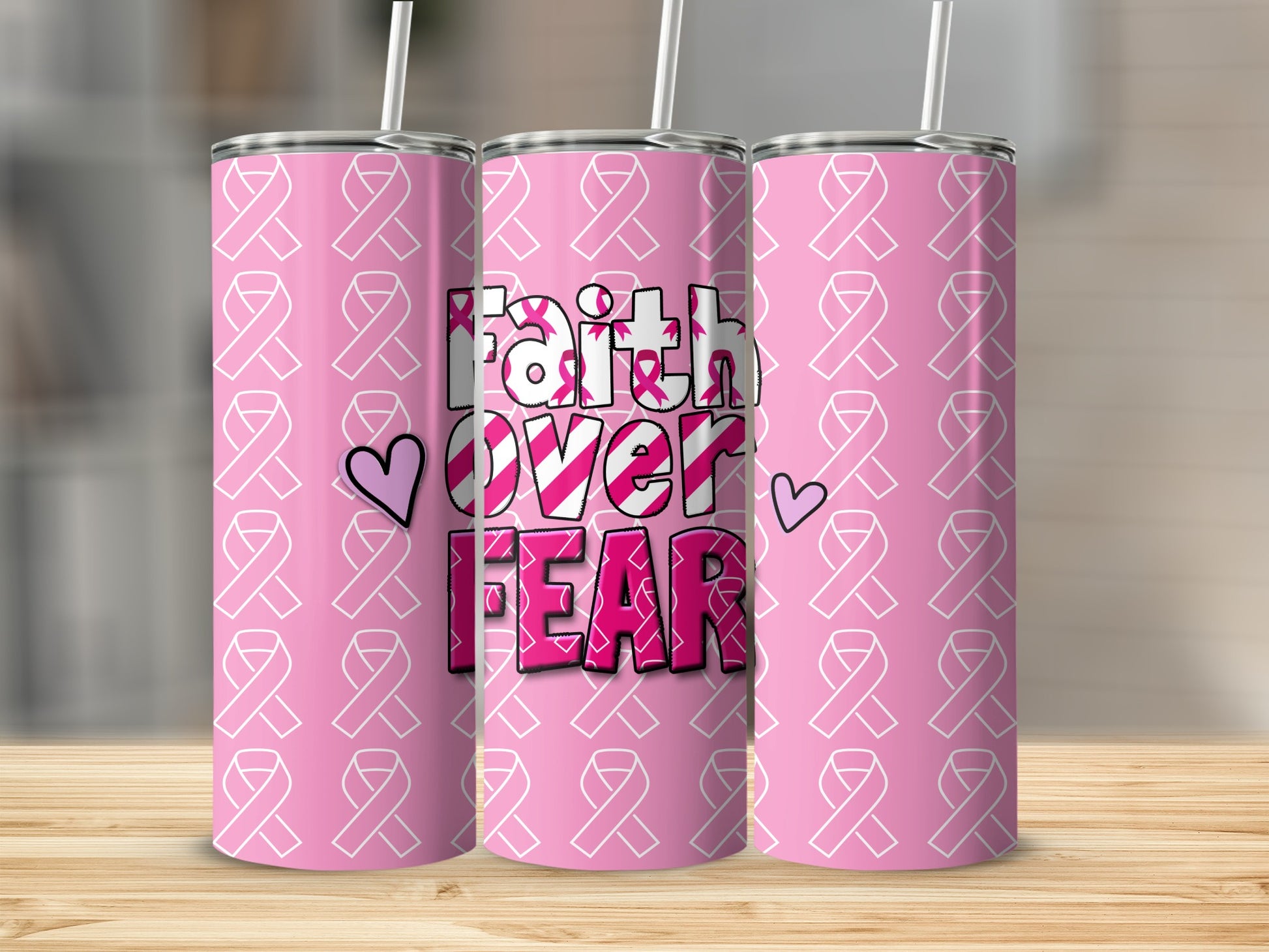 Pink tumbler with "Faith Over Fear" text and breast cancer ribbons.