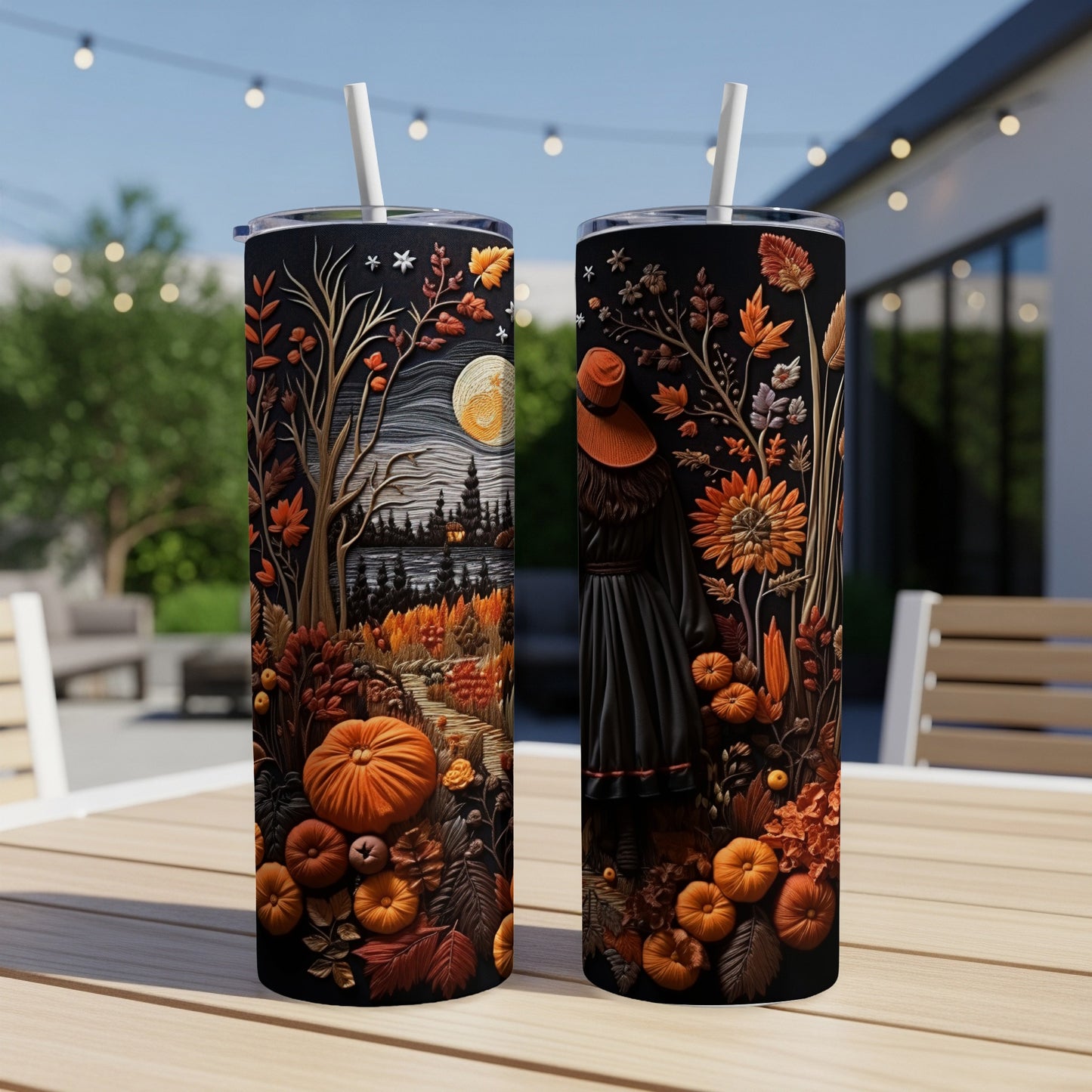 Two tumblers with Halloween-themed designs of pumpkins, leaves, and a moonlit landscape.