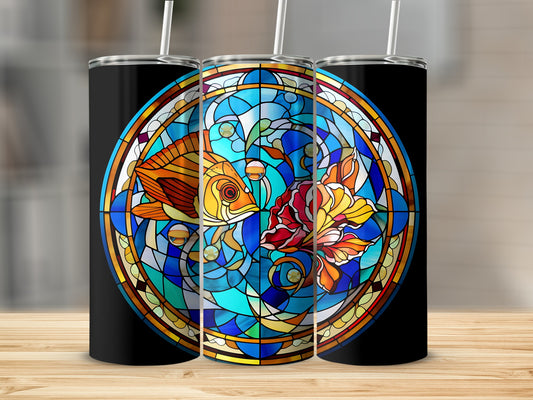 Black tumbler with a round stained glass design of two goldfish swimming.