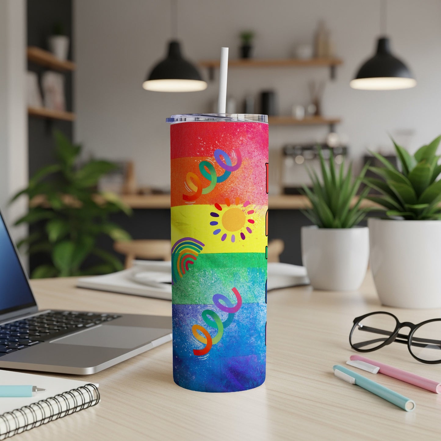 Rainbow Pride tumbler with bright colors and abstract splashes.