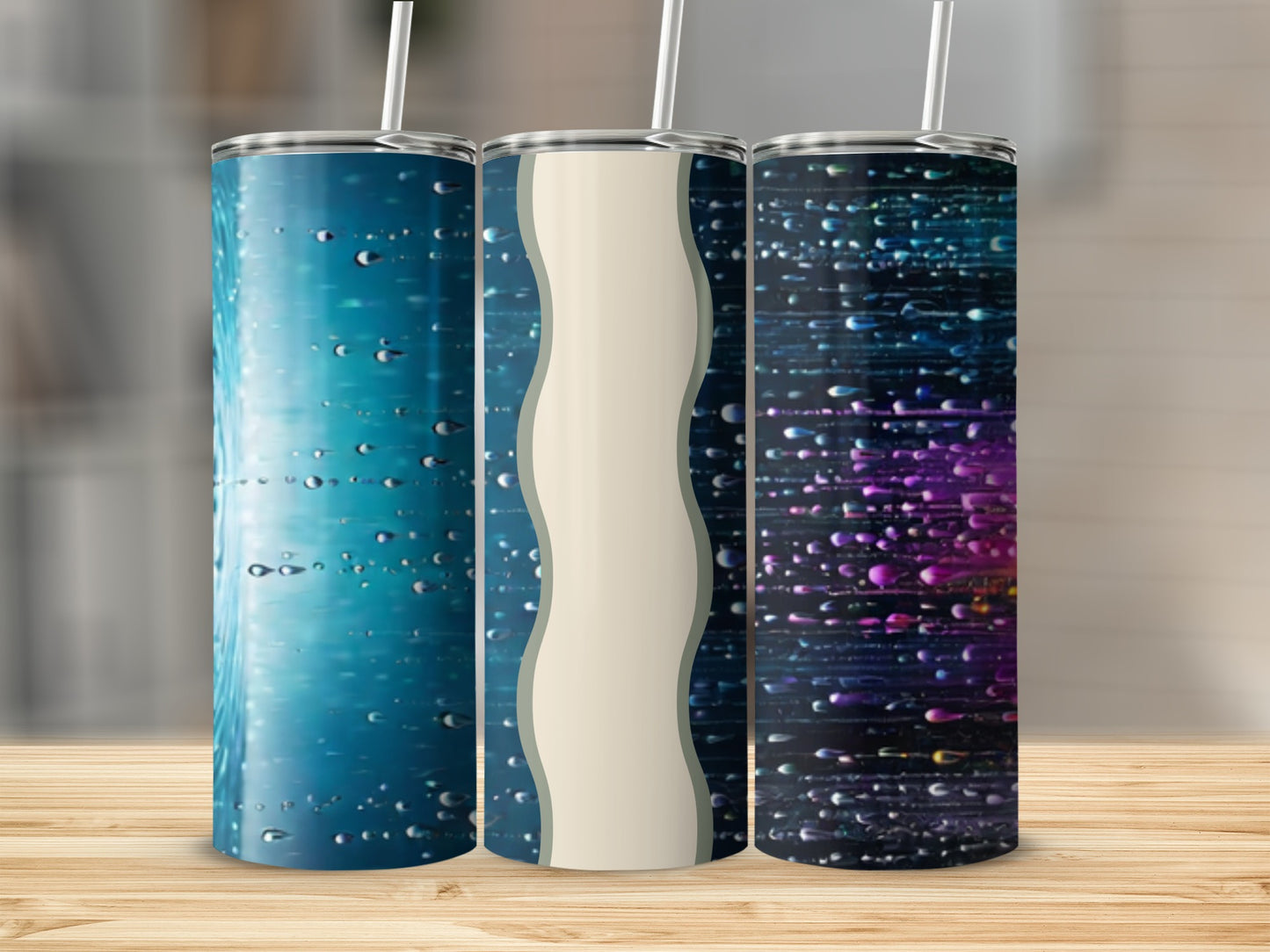 Three tumblers with water drop and abstract light designs.
