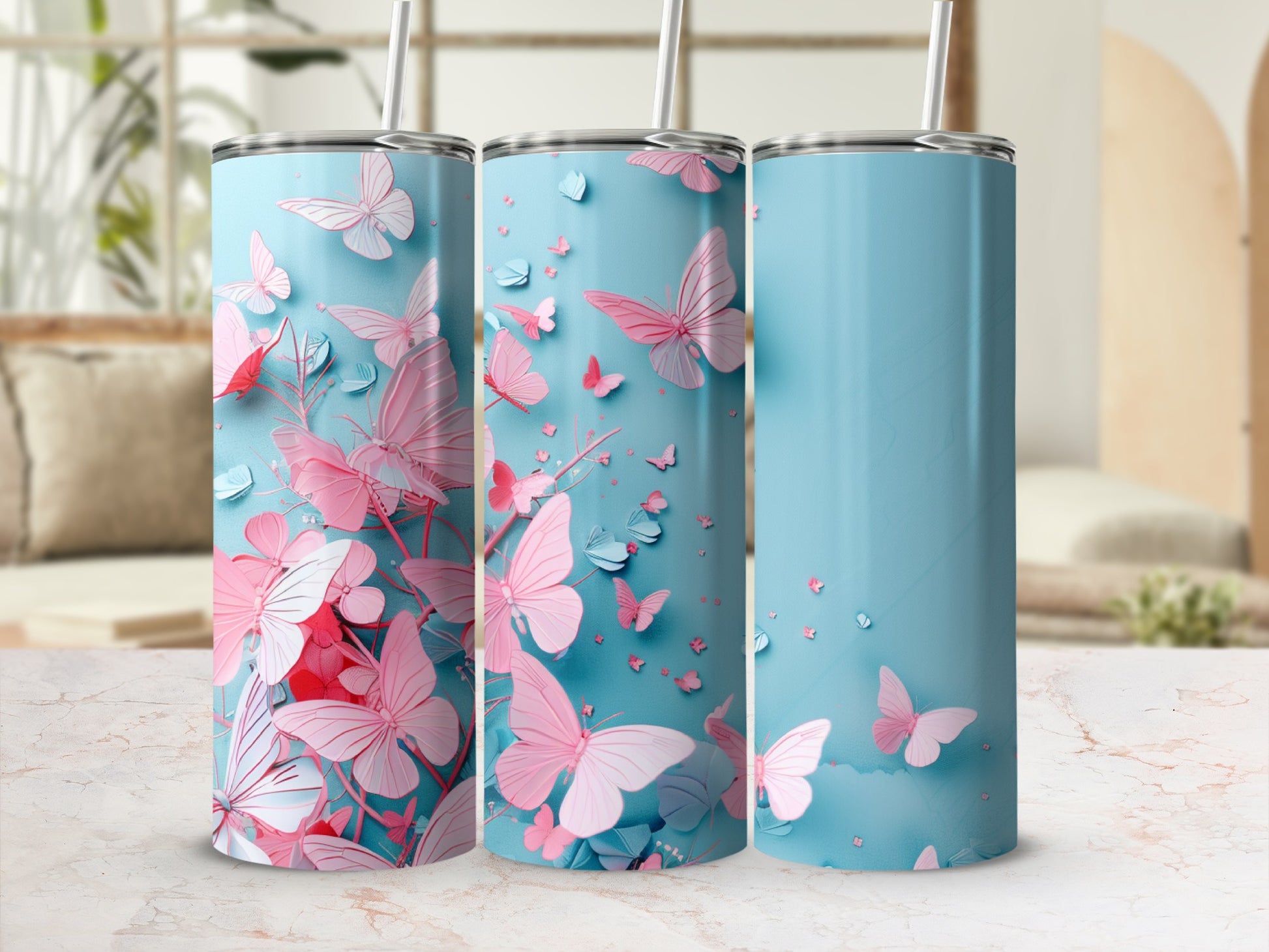 Three tall, light blue tumblers with a repeating pink butterfly pattern.