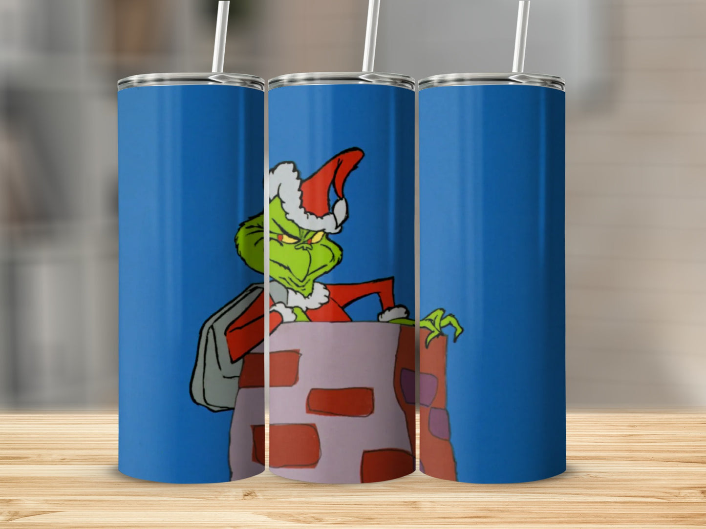 The Grinch climbing out of a chimney, wearing a Santa hat.