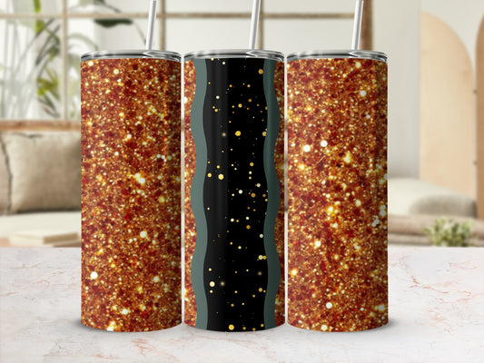Three glittery tumblers with straws on a marble surface.