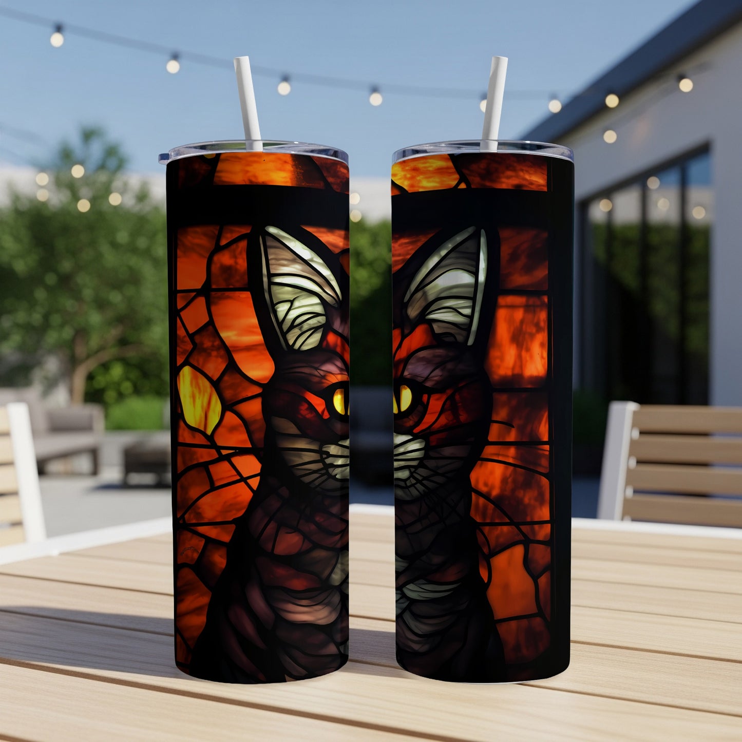 Stained glass black cat with glowing yellow eyes on a black tumbler.