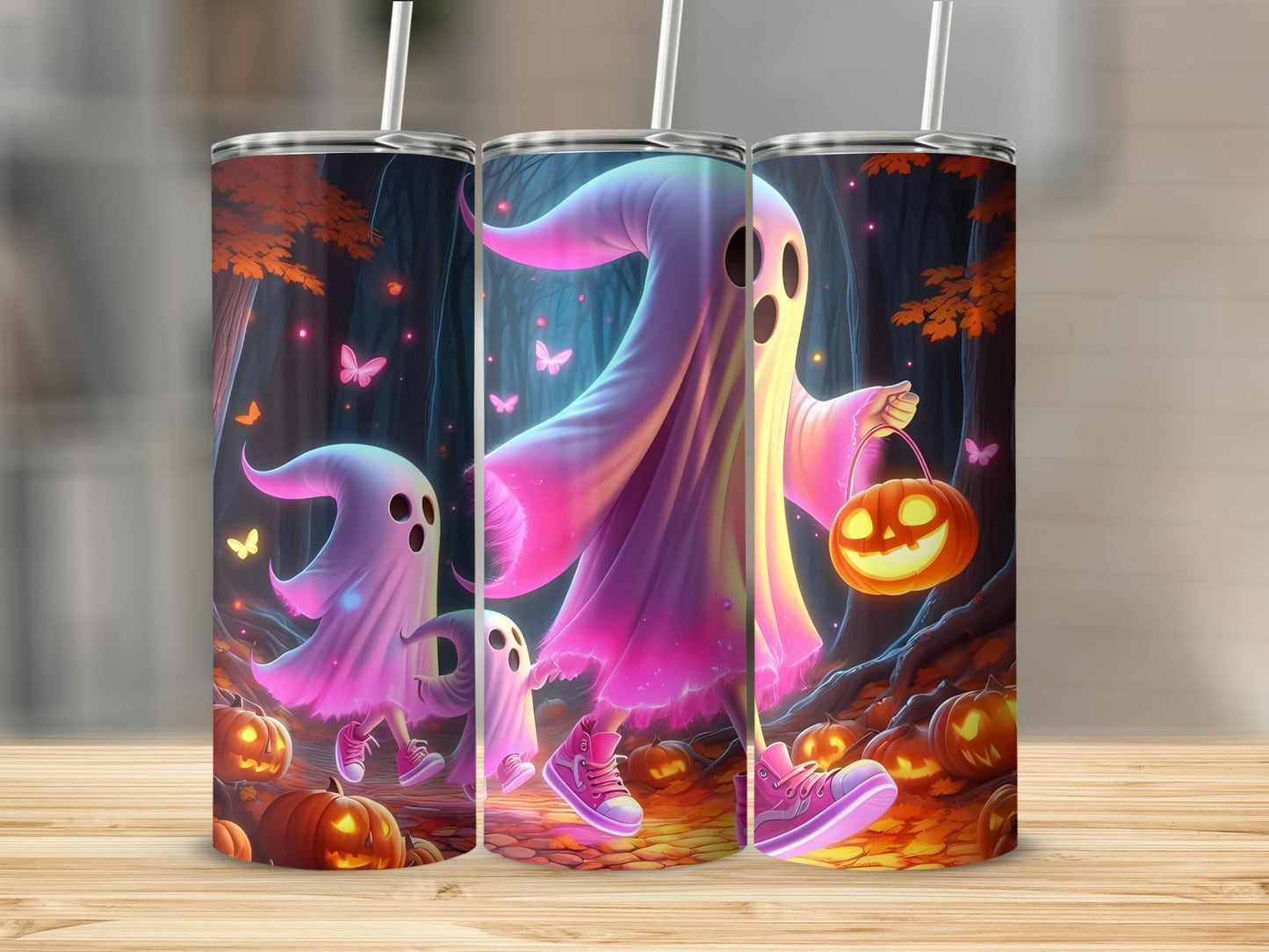 Three tumblers display ghosts in a spooky forest with pumpkins and butterflies.